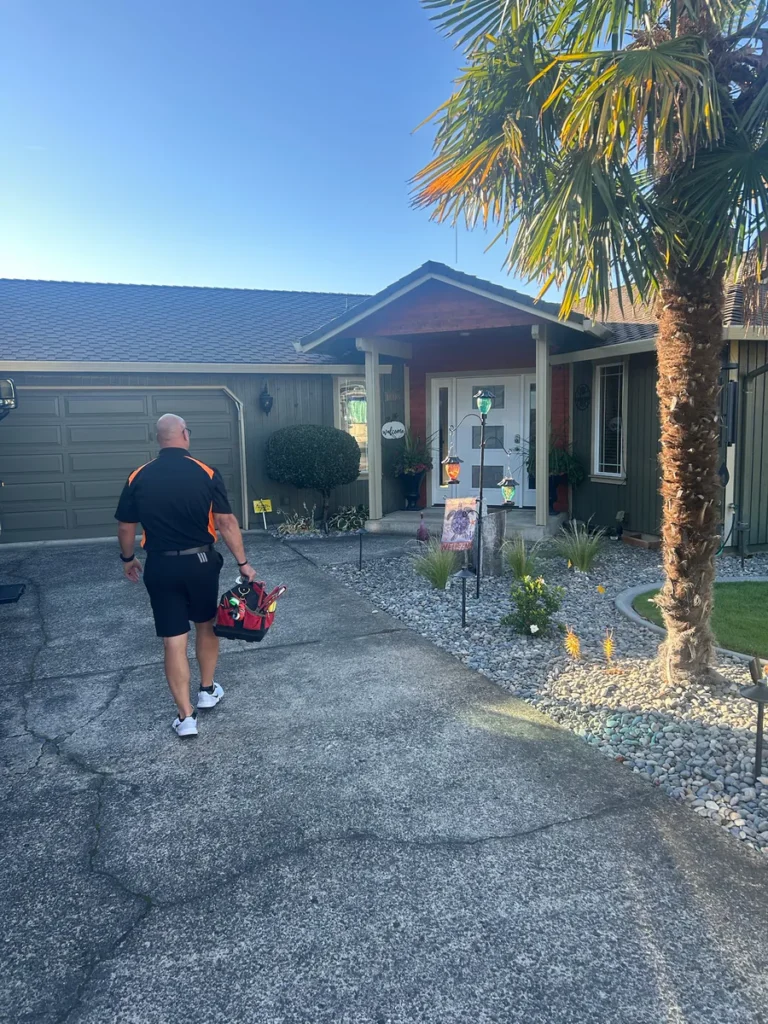 Plumber walking up the driveway