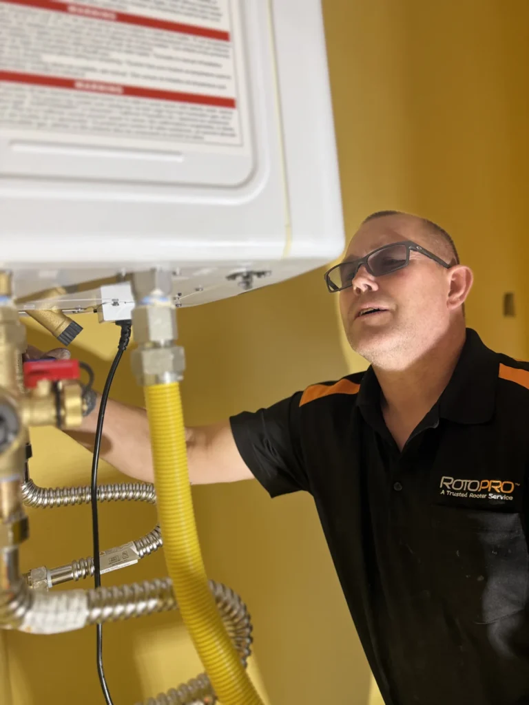 Plumber inspecting gasline