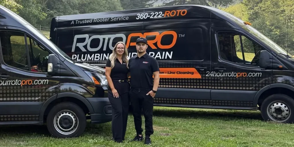 Roto Pro staff members standing in front of the company van