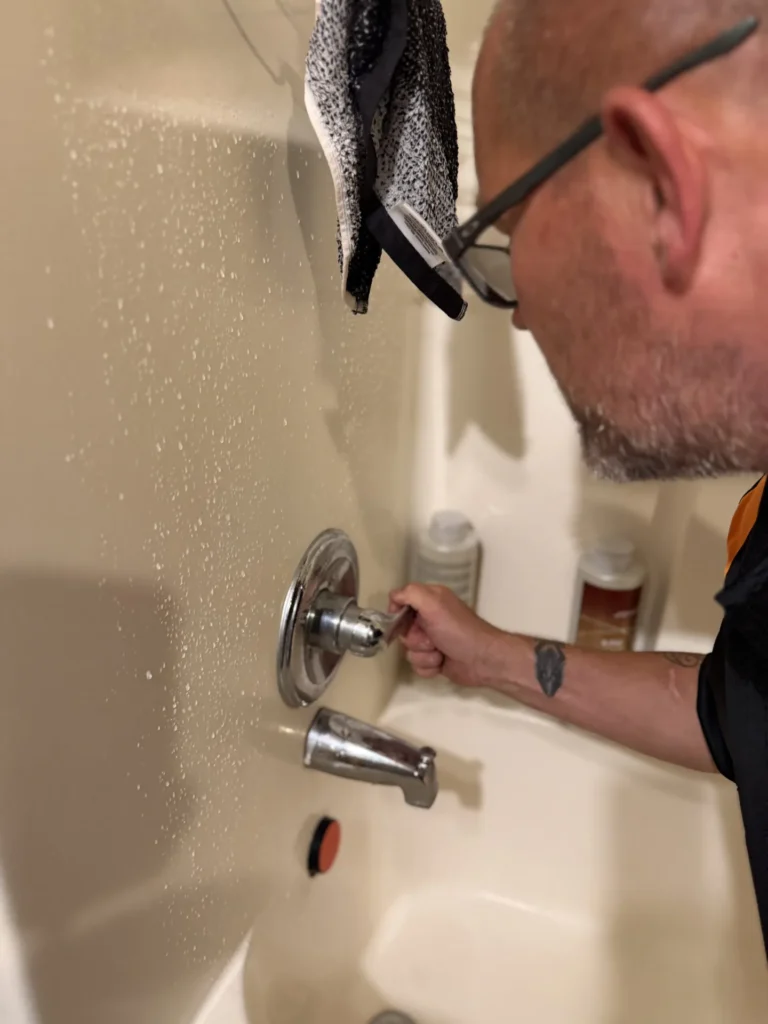 Plumber opening the tap
