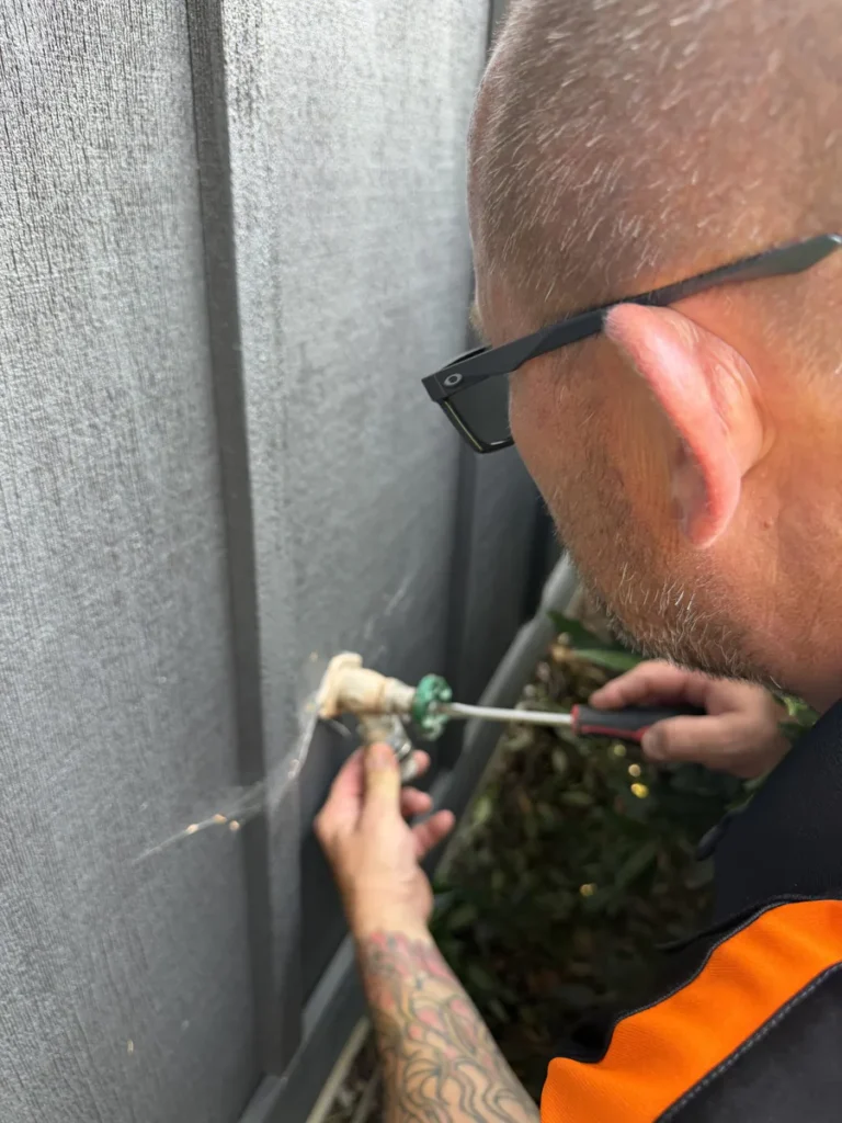 Plumber fixing a valve