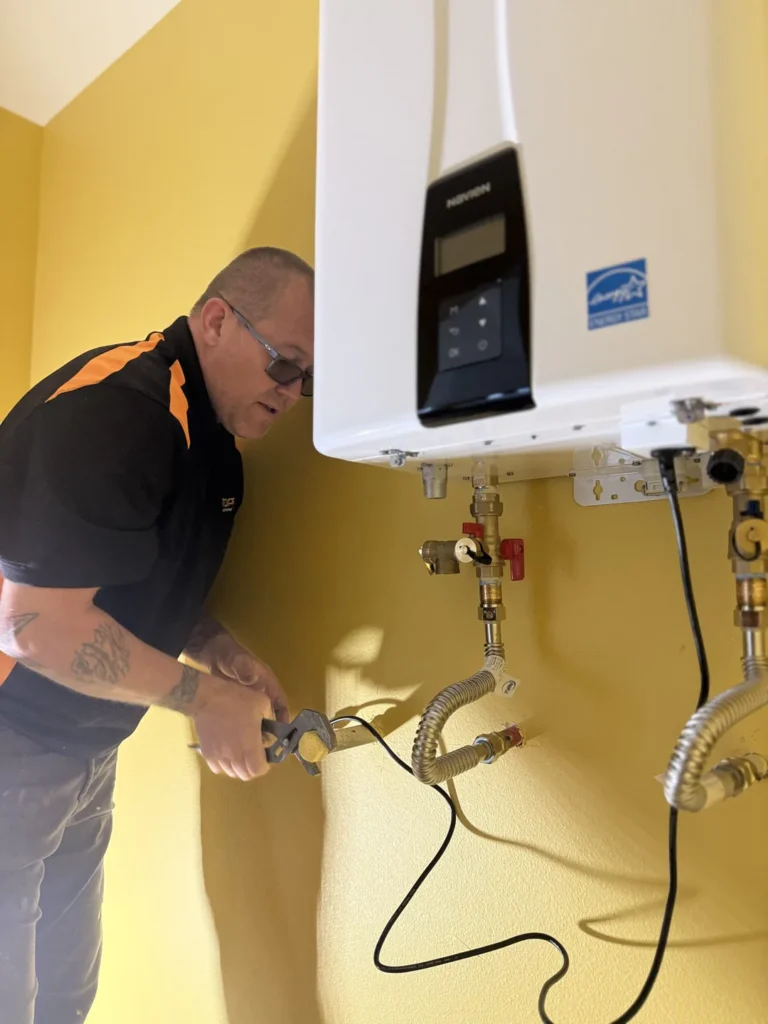 Plumber fixing plumbing pipes