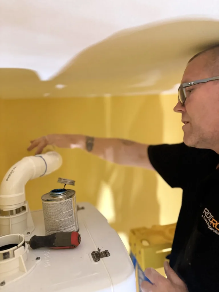 Plumber operating on a pipe